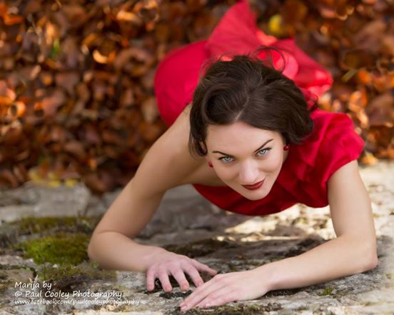 Lady in red dress by the 12th century tower at Blackwater Castle